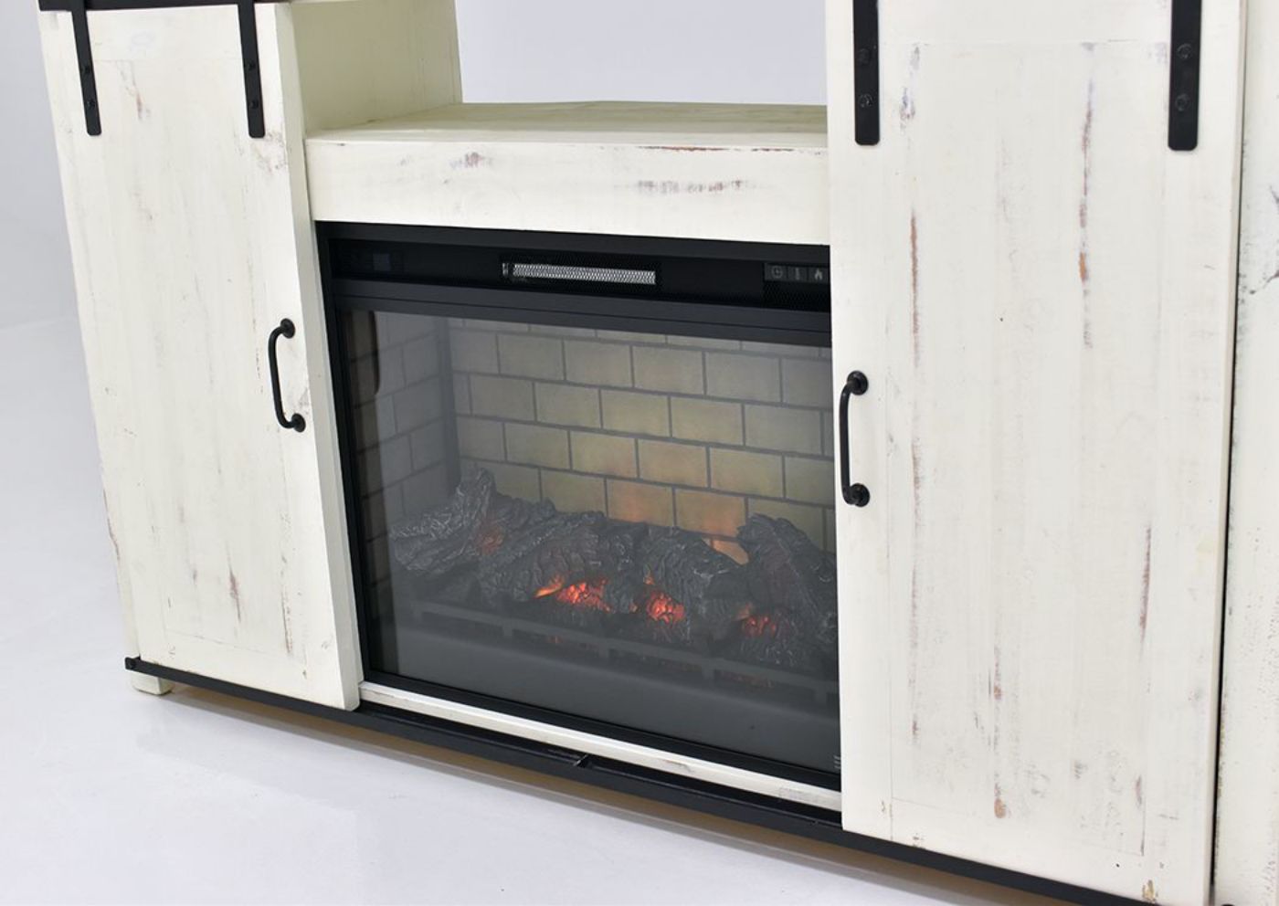 View of the Fireplace Insert in the Distressed White Maverick TV Stand by Vintage | Home Furniture Plus Bedding