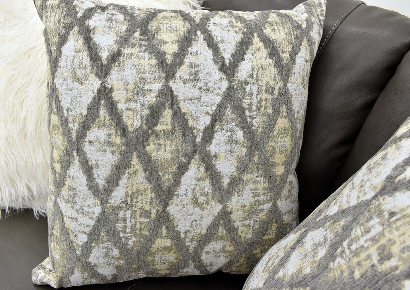 Warm Gray Lizette Leather Loveseat by Franklin Furniture Showing the Patterned Accent Pillow Detail, Made in the USA | Home Furniture Plus Bedding