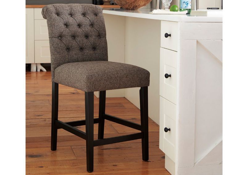 Tripton 24 Inch Warm Gray Upholstered Bar Stool by Ashley Showing the Room View | Home Furniture Plus Bedding