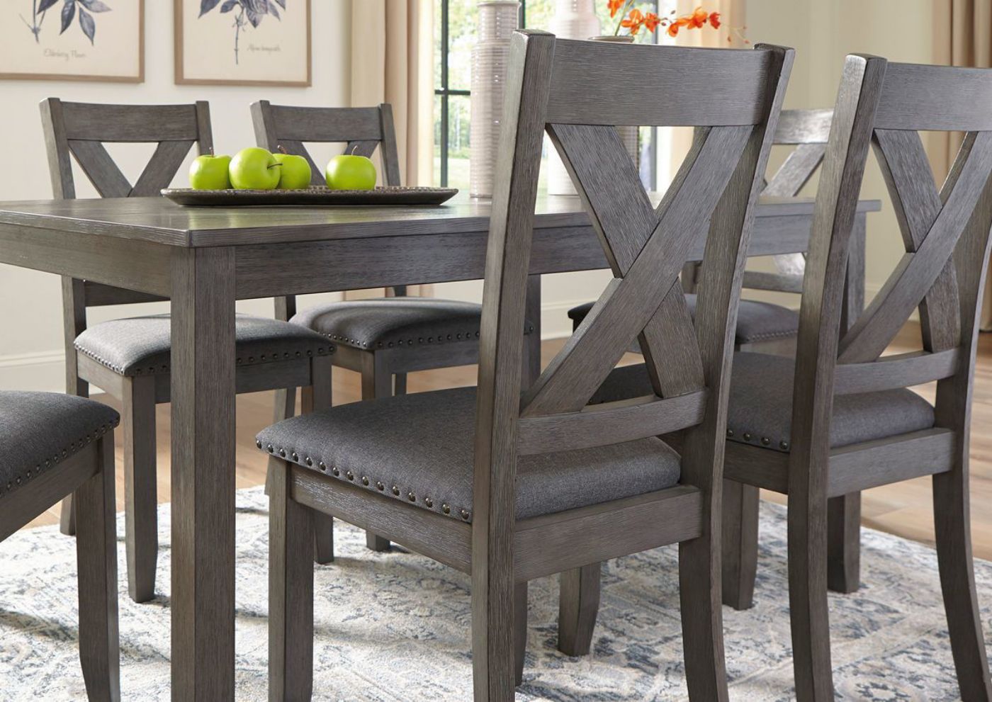 Gray Caitbrook 7 Piece Dining Set by Ashley Furniture Showing a Mood View | Home Furniture Plus Bedding