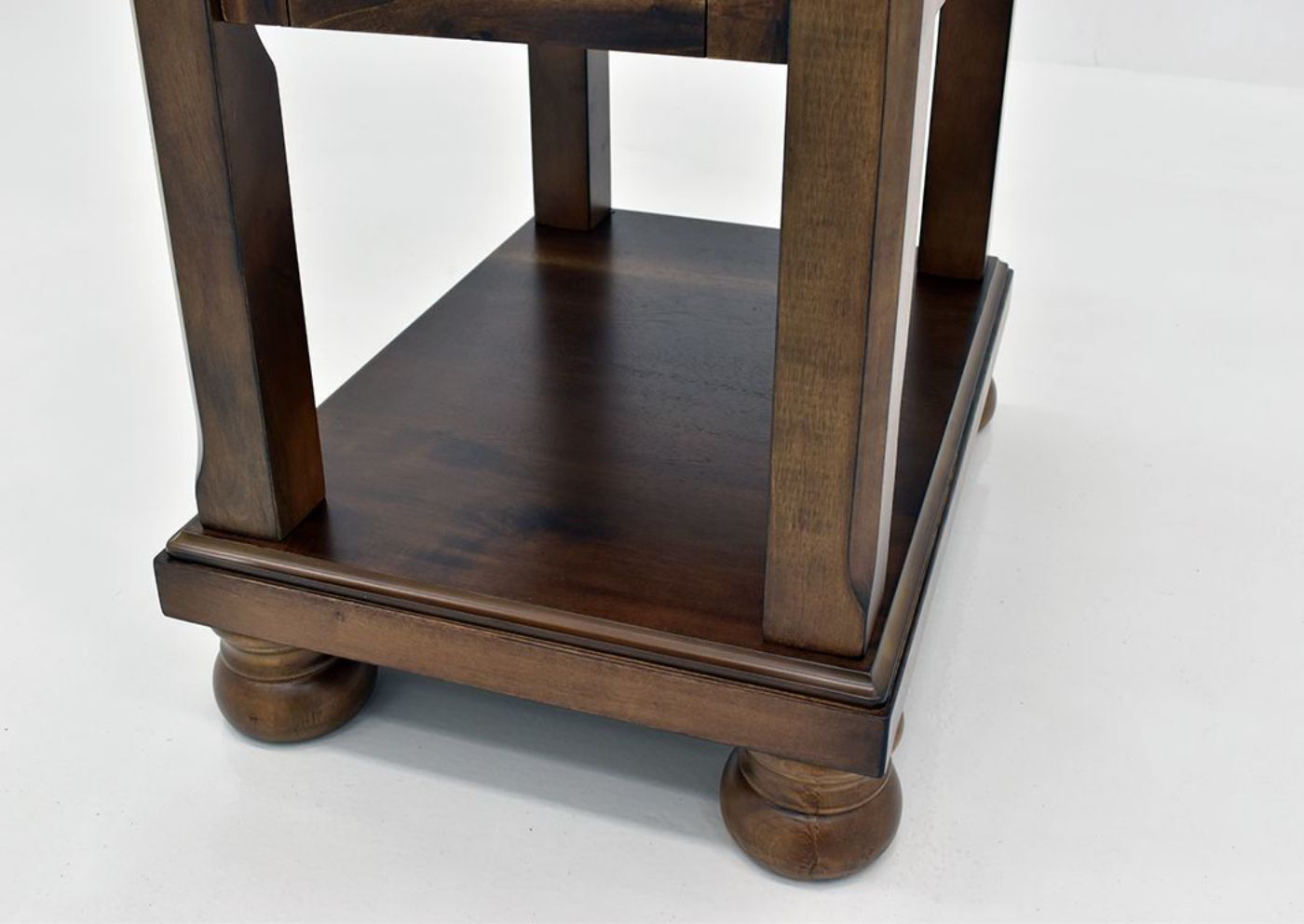Chestnut Brown Flynnter Chairside End Table by Ashley Furniture Showing the Lower Shelf Detail | Home Furniture Plus Mattress