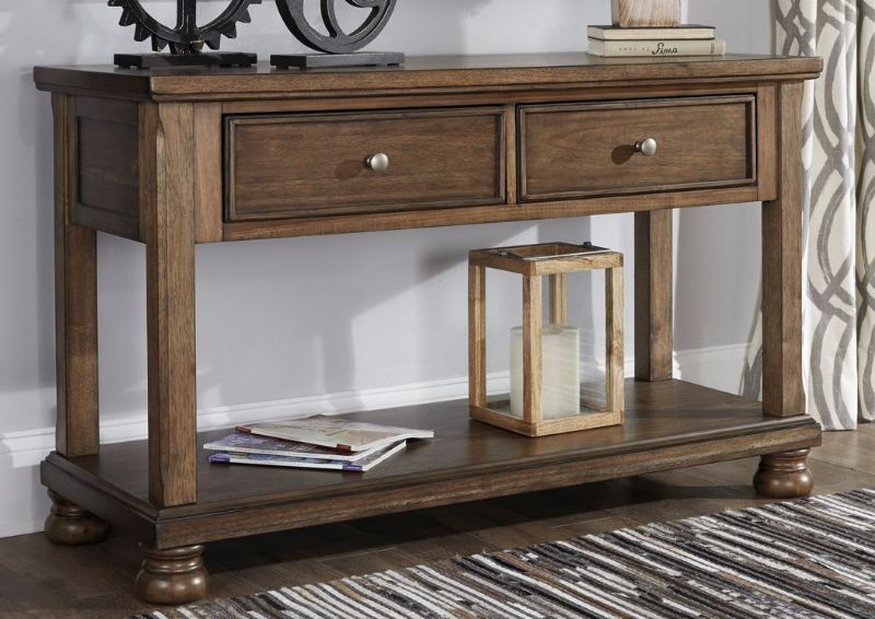 Chestnut Brown Flynnter Sofa Table by Ashley Furniture in a Room Setting | Home Furniture Plus Mattress