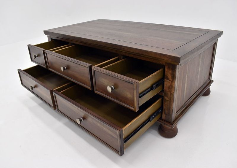 Chestnut Brown Flynnter Coffee Table by Ashley Furniture at an Angle With the Drawers Open | Home Furniture Plus Mattress