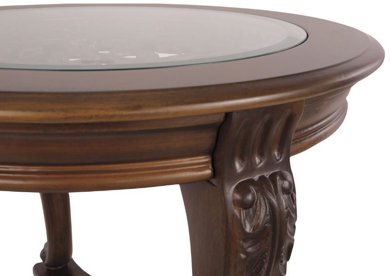 Brown Norcastle Round End Table by Ashley Furniture Showing the Glass Top and Decorative Detail | Home Furniture Plus Bedding