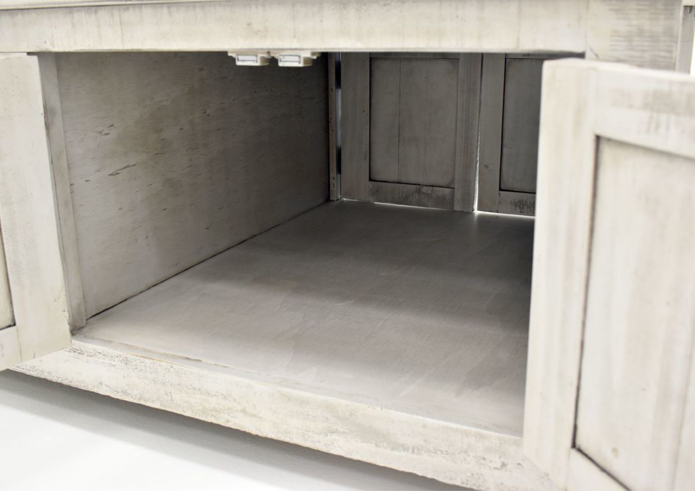 Gray San Andres Coffee Table by International Furniture Showing the Cabinet Interior | Home Furniture Plus Bedding