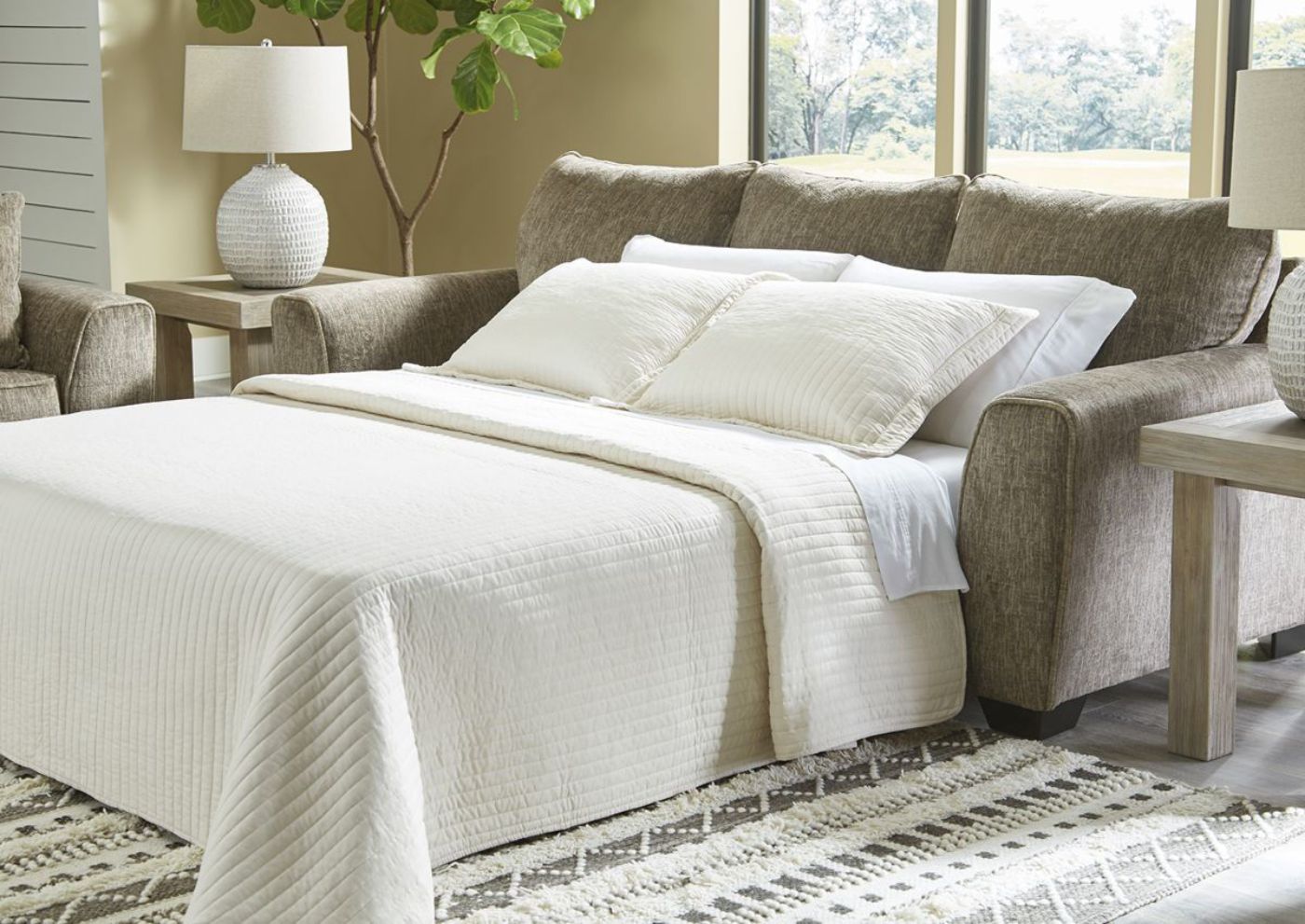 Chocolate Brown Olin Sleeper Sofa by Ashley Furniture Showing the Room View With the Sleeper Open | Home Furniture Plus Bedding