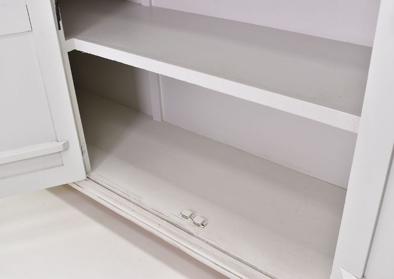 White Capri 4 Door Cabinet by International Furniture Showing the Cabinet Interior Shelving Detail | Home Furniture Plus Bedding