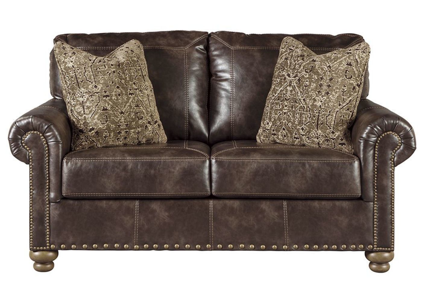 Front Facing Nicorvo Loveseat by Ashley Covered in Brown Upholstery with Accent Pillows | Home Furniture + Mattress