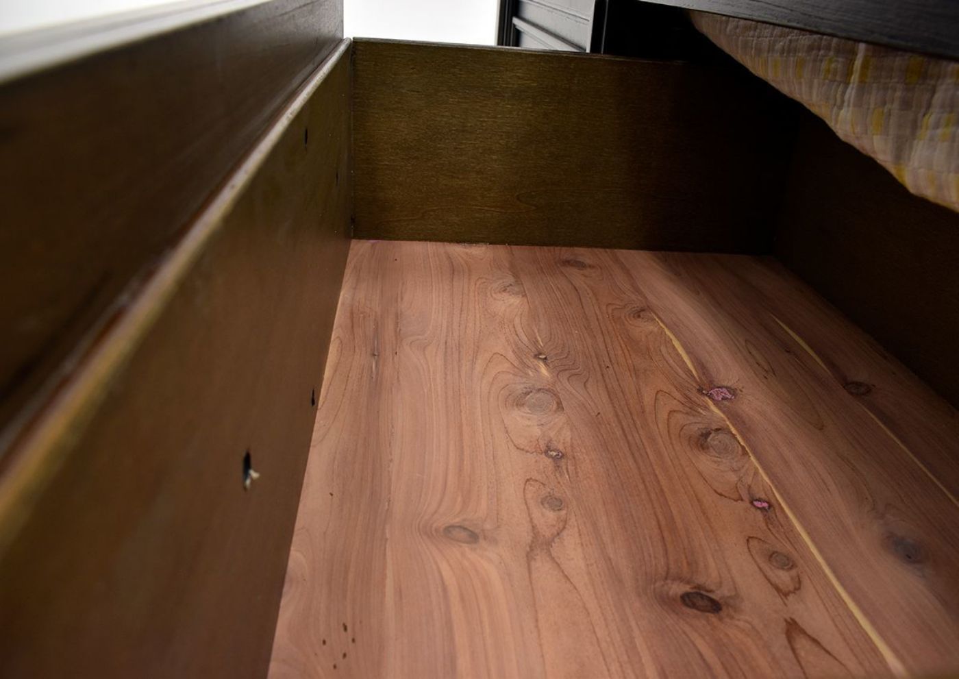 Dark Brown Sofia Laure Queen Size Bed by Avalon Furniture Showing the Cedar Lined Drawer Interior | Home Furniture Plus Bedding