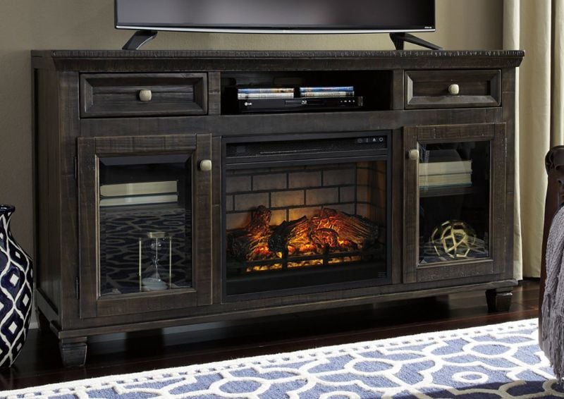 Dark Brown Townser TV Stand with Fireplace by Ashley Furniture Showing the Room Setting | Home Furniture Plus Mattress