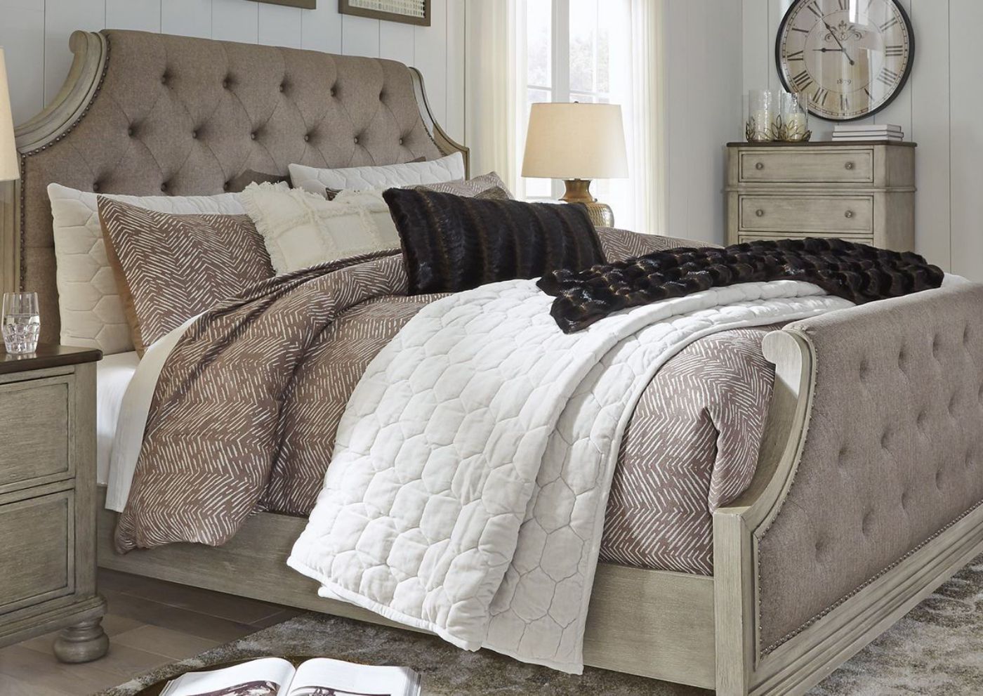 Slight Angled Side View of the Falkhurst King Size Upholstered Bed by Ashley Furniture | Home Furniture Plus Bedding
