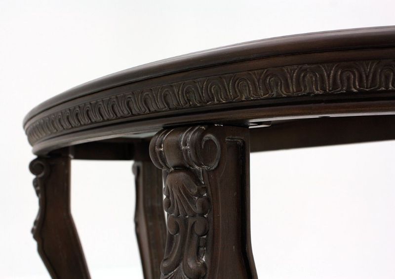 Brown Charmond Round Sofa Table by Ashley Furniture Showing the Carved Details | Home Furniture Plus Bedding