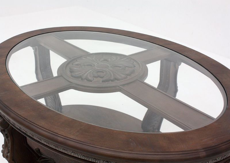 Brown Charmond Oval Coffee Table by Ashley Furniture Showing the Glass Top | Home Furniture Plus Mattress