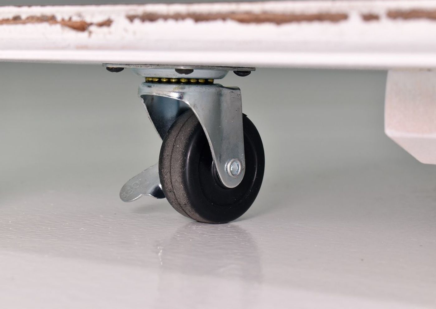 Close Up of the Casters on the Magnolia Manor Square Coffee Table | Home Furniture Plus Bedding