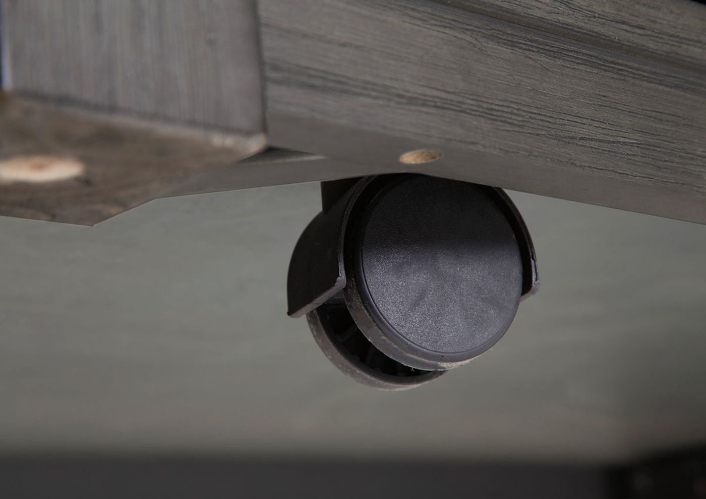 Close Up of the Convenient Caster Wheels on the Caitbrook Coffee Table | Home Furniture Plus Bedding