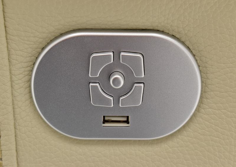 Close Up of the Power Button on the Off White Spartacus POWER Reclining Sofa | Home Furniture Plus Bedding