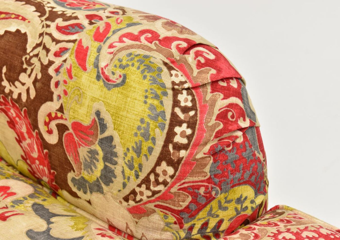 Close Up View of the Pleated Charles of London Arms on the Multi-Colored Teak Cardinal Swivel Glider by Chairs America | Home Furniture Plus Bedding