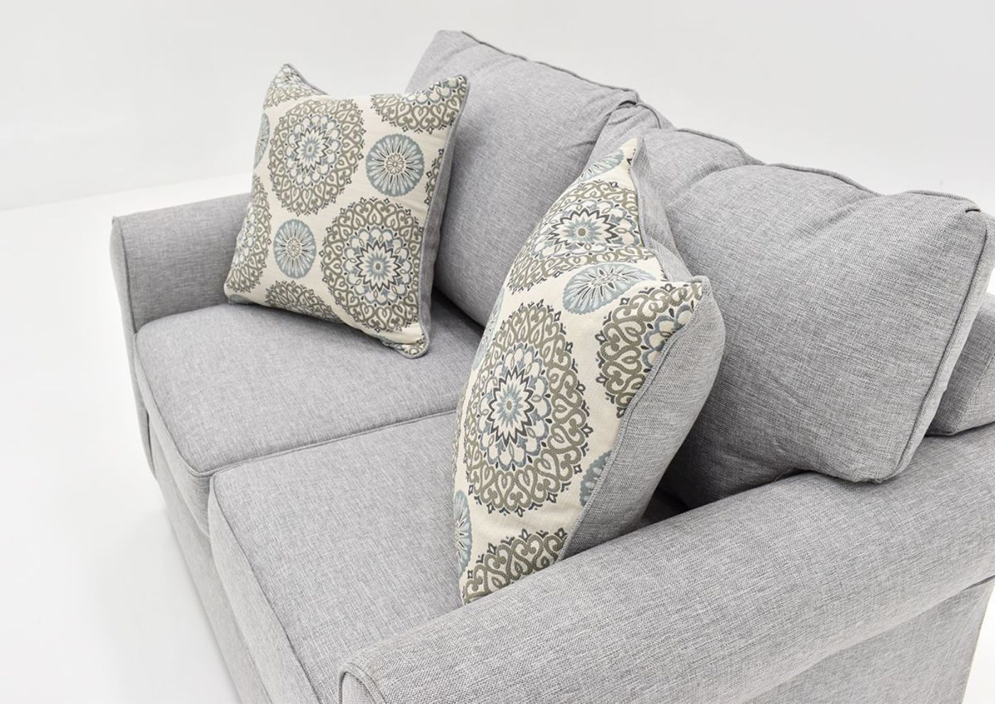 Angled Side View Displaying the Accent Pillows on the Vivian Loveseat by Behold Home | Home Furniture Plus Bedding
