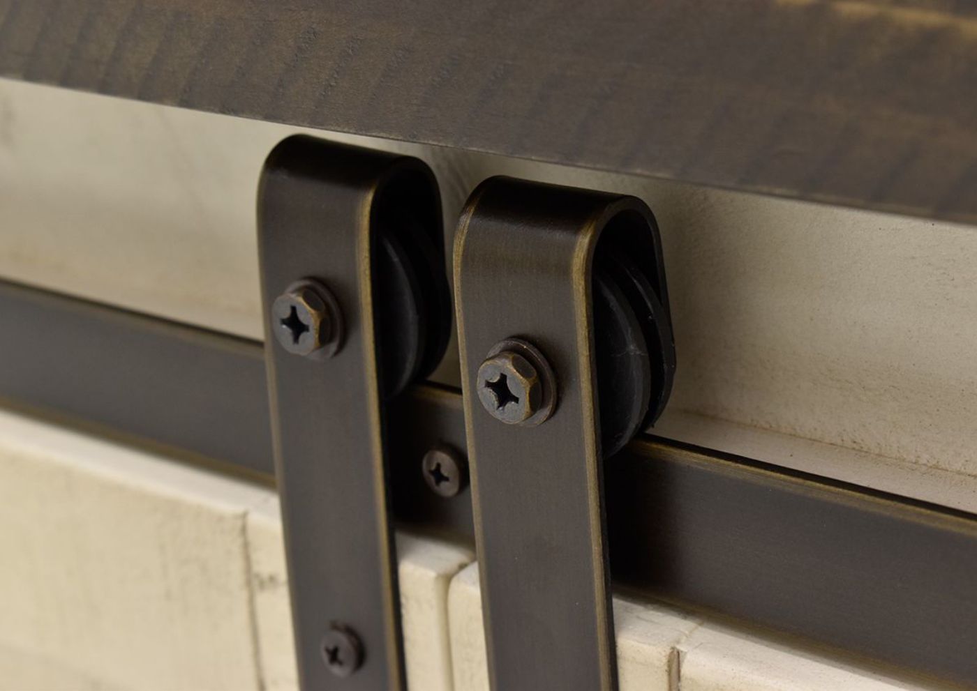 Close Up View of the Sliding Barn Door Hardware on the Madison County Cabinet in White by Jofran | Home Furniture Plus Bedding
