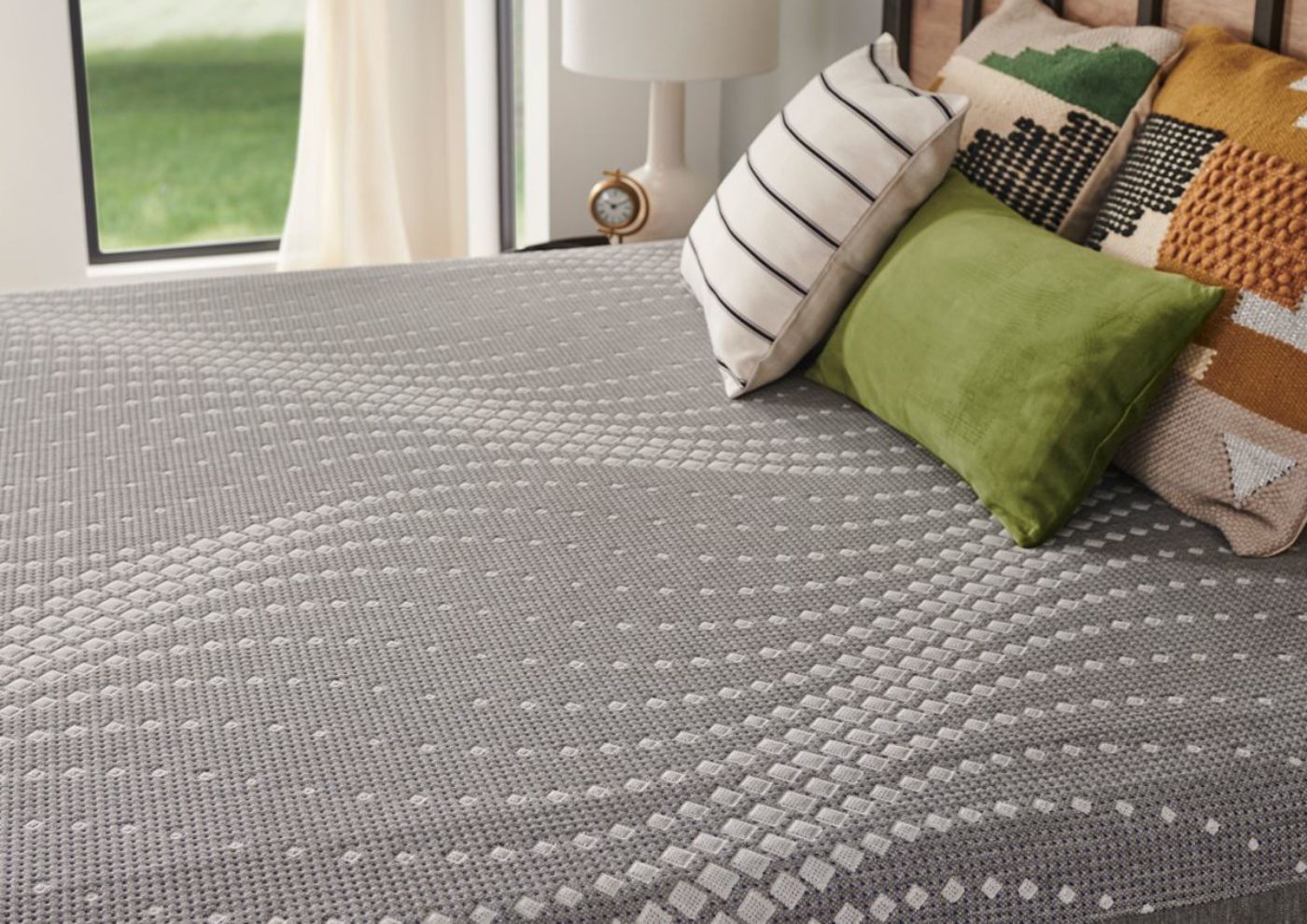 Closeup Angled Room View of the Sealy Posturepedic Hybrid Medina Firm Mattress in Queen Size | Home Furniture Plus Bedding