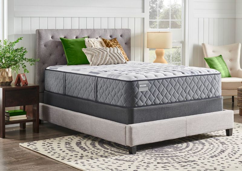 Slightly Angle View of the Sealy Posturepedic Mirabai Firm Mattress In a Room Setting | Home Furniture Plus Bedding