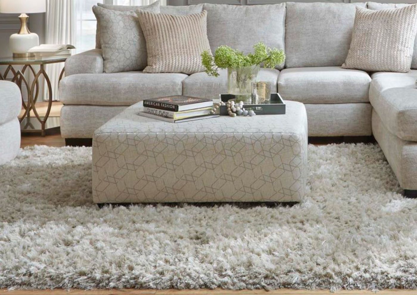 Room Shot of the Gabriella Cocktail Ottoman with a Sofa in the Background | Home Furniture Plus Bedding
