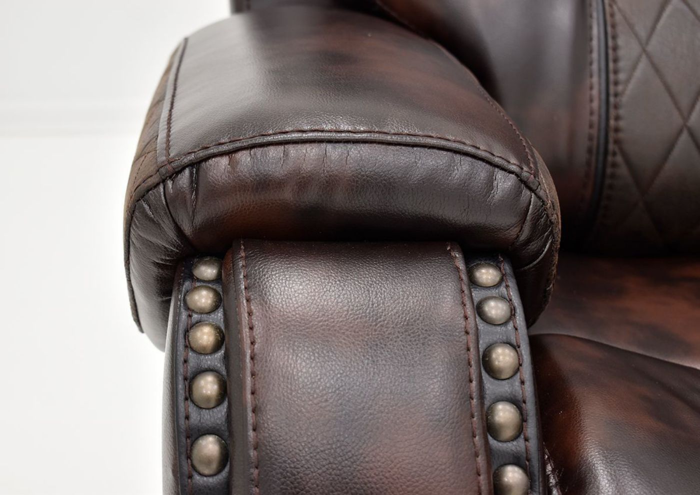 Close Up of Cushion Armrest and Nailhead Trim on the Granger POWER Reclining Sectional Sofa - Brown | Home Furniture Plus Bedding