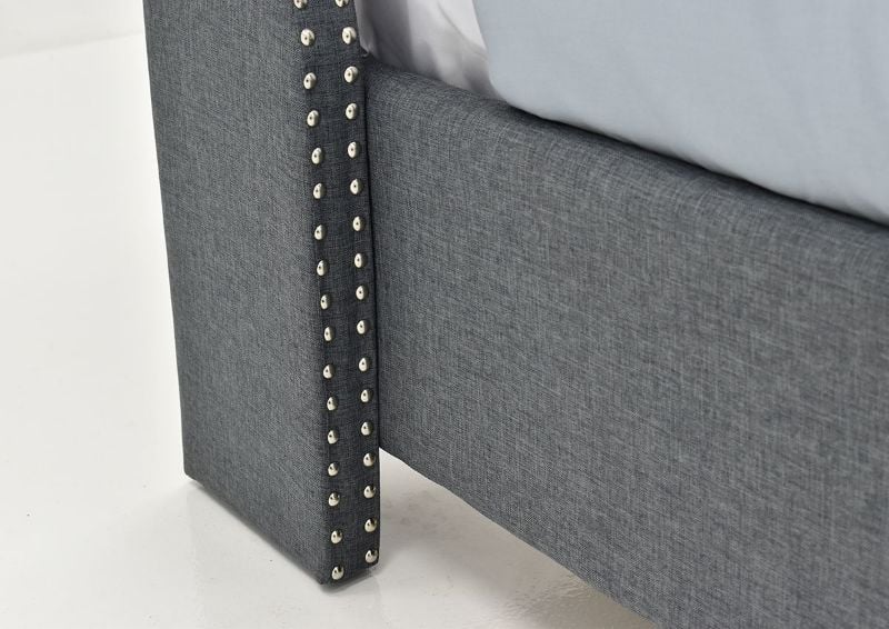 Close Up View of the Nailhead Trim on the Footboard of the Eva Queen Size Upholstered Bed in Gray by Crown Mark, Intl. | Home Furniture Plus Mattress