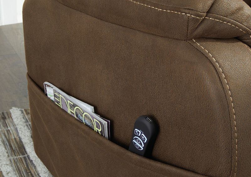 Closeup View of the Side Storage Pocket on the Whitehill POWER Lift Recliner in Chocolate Brown by Ashley Furniture | Home Furniture Plus Bedding