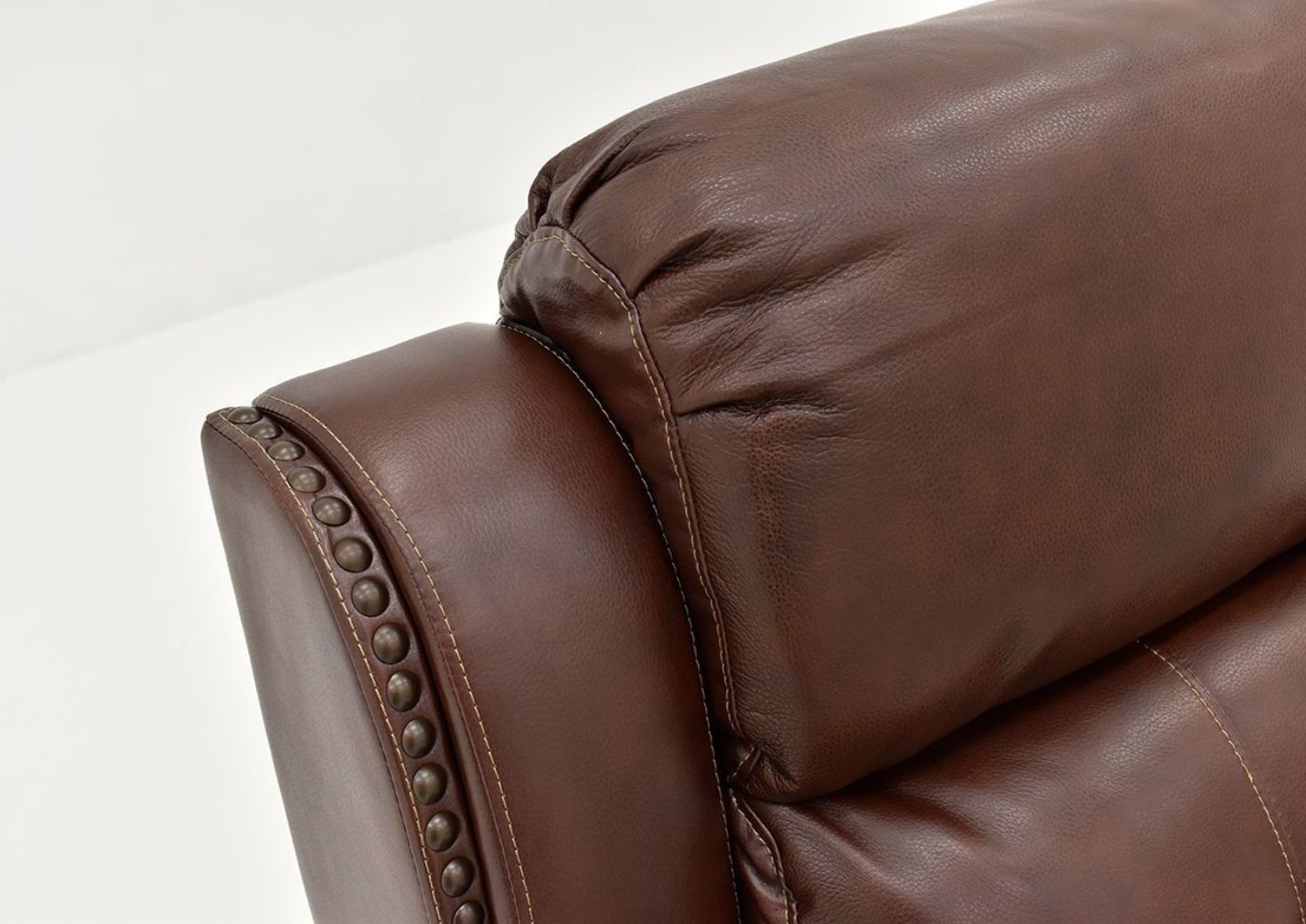 Closeup View of the Rosewood Leather Reclining Sofa in Warm Brown by Behold Home Showing Details | Home Furniture Plus Bedding