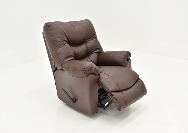 Angled View of the Footrest Raised on the Trilogy Leather Rocker Recliner in Dark Brown by Franklin Corporation | Home Furniture Plus Bedding