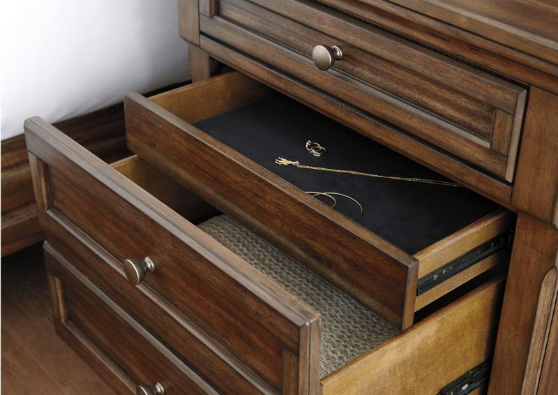 Close Up View of the Tobacco Brown Flynnter Nightstand by Ashley Furniture with Opened Drawers | Home Furniture Plus Bedding