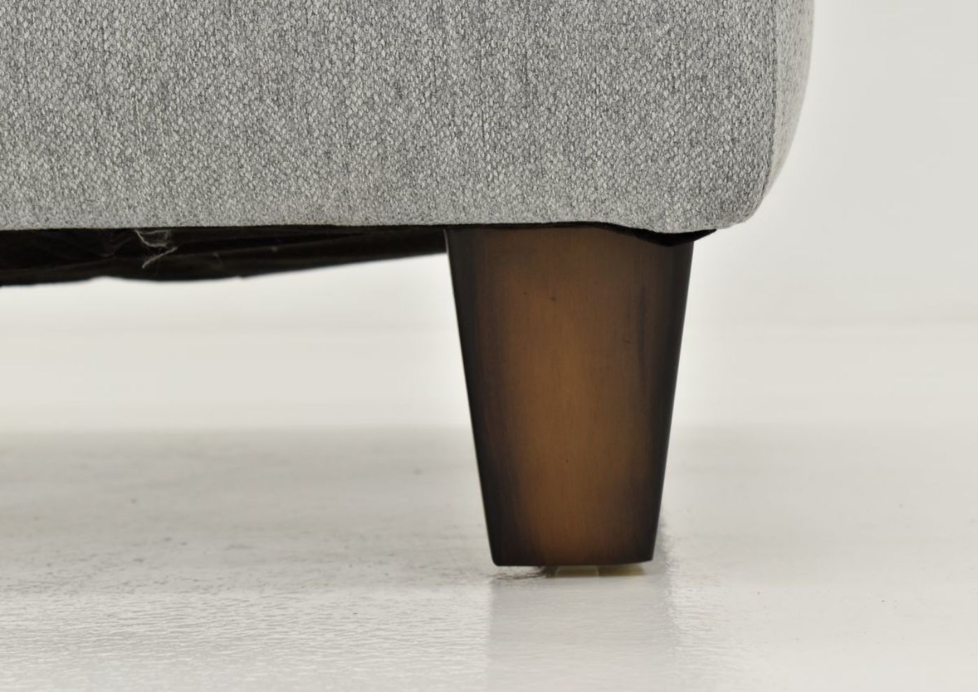 Close Up View of the Leg on the Bradshaw Ottoman by Franklin Corporation | Home Furniture Plus Bedding