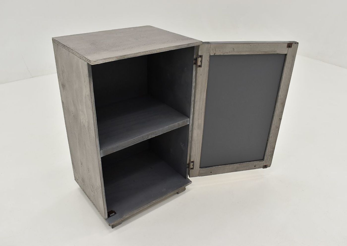 Slightly Angled View with Cabinet Door Open, showing 2 interior storage spaces with shelf on the Fish Accent Cabinet - Granite Gray | Home Furniture Plus Bedding
