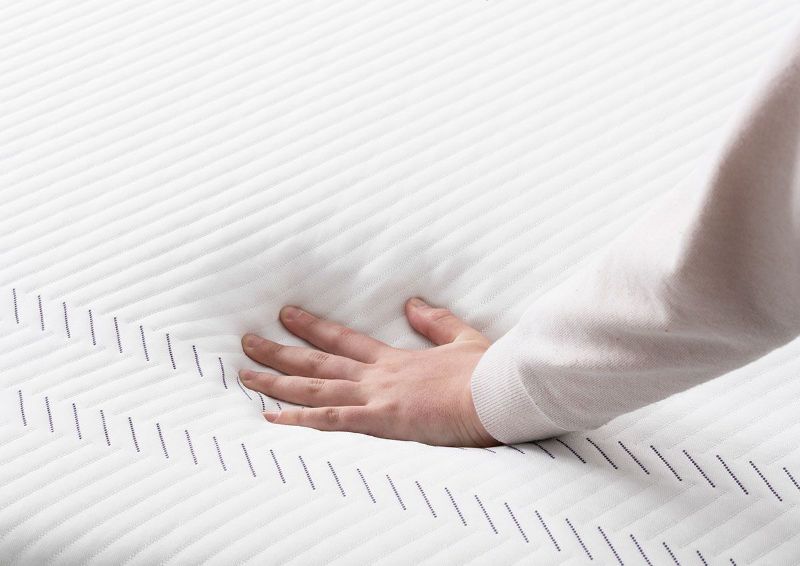 Hands Testing the Feel on the Purple Grid on the Purple® Hybrid 2 Mattress by Purple® Innovation LLC | Home Furniture Plus Bedding
