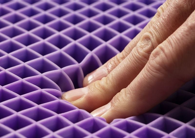 Fingers Testing the Feel of the Purple Grid of the Purple® Mattress by Purple® Innovation LLC | Home Furniture Plus Bedding