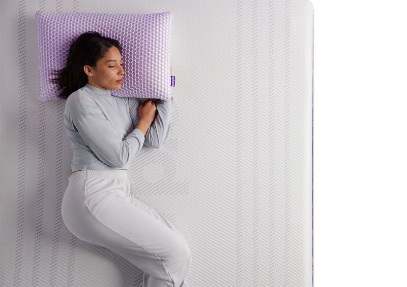 Woman Sleeping on the Purple® Hybrid Premier 4 Mattress by Purple® Innovation LLC | Home Furniture Plus Bedding