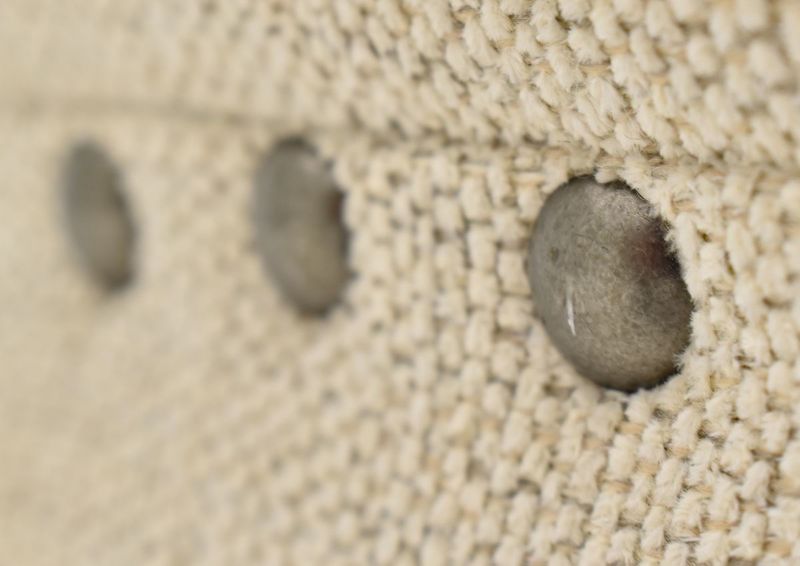 Close Up View of the Nailhead Trim on the Everette Loveseat in Off-White by Klaussner | Home Furniture Plus Bedding