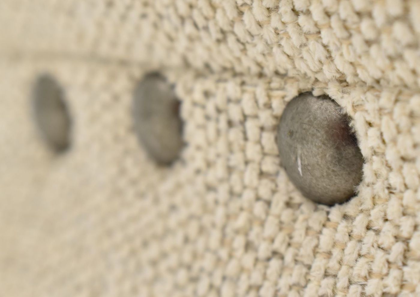 Close Up View of the Nailhead Trim on the Everette Sofa Set in Off-White by Klaussner | Home Furniture Plus Bedding