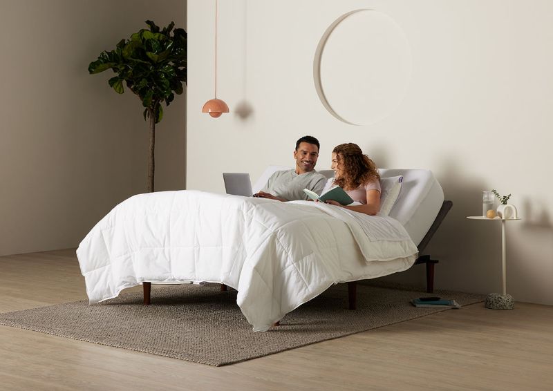 Room View of a Couple on the Purple Ascent Adjustable Base in Queen Size  | Home Furniture Plus Bedding