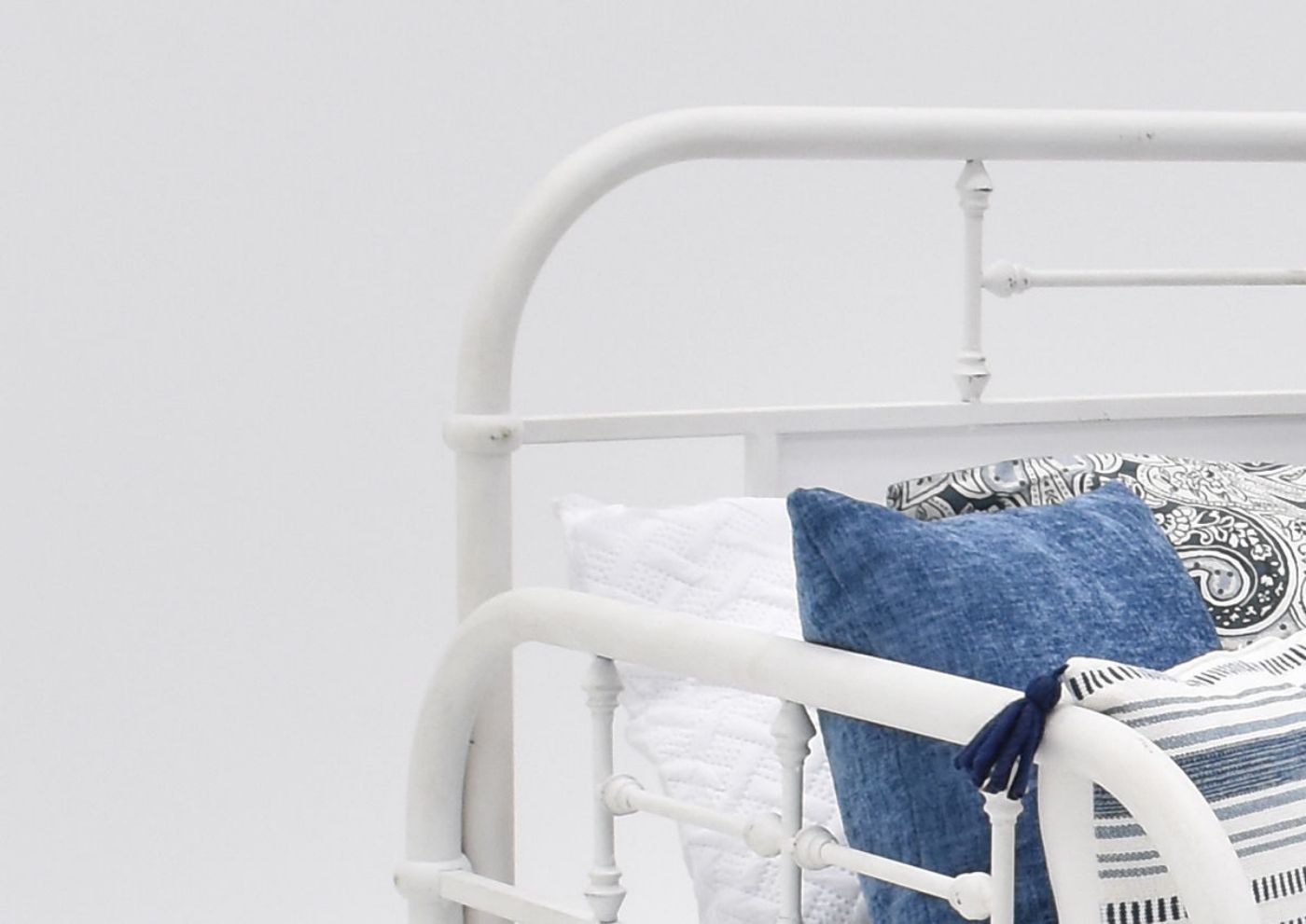 Close Up View of the Back and Side of the Vintage Metal Daybed in White by Liberty Furniture | Home Furniture Plus Bedding