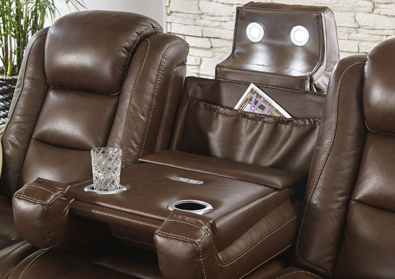 Close Up View of the Man-Den Power Reclining Sofa in Mahogany Brown by Ashley Furniture | Home Furniture Plus Bedding