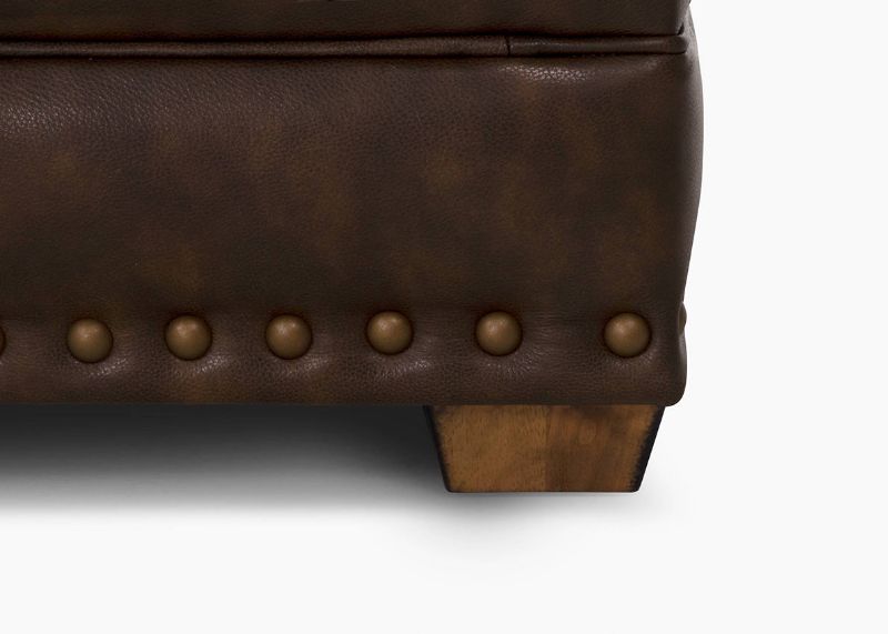 Close Up View of the Foot and Nailhead Trim on the Tula Leather Sofa in Brown by Franklin Industries | Home Furniture Plus Bedding