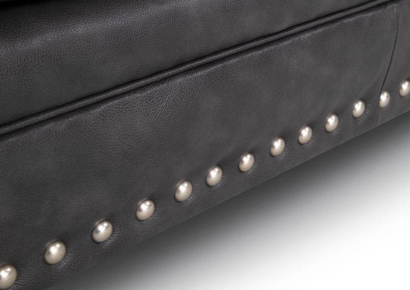 Close Up View of the Nailhead Trim on the Della Leather Ottoman in Gray by Franklin Corporation | Home Furniture Plus Bedding