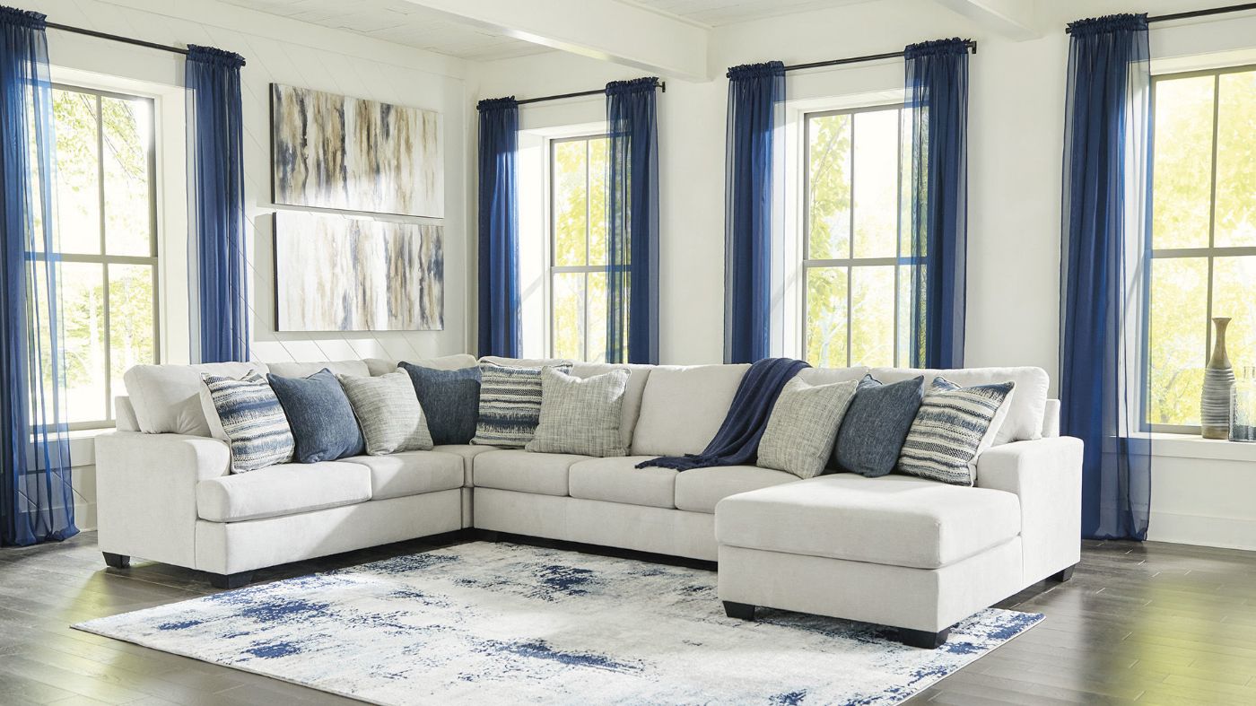 Room View of the Lowder Sectional Sofa in Stone Gray by Ashley Furniture | Home Furniture Plus Bedding