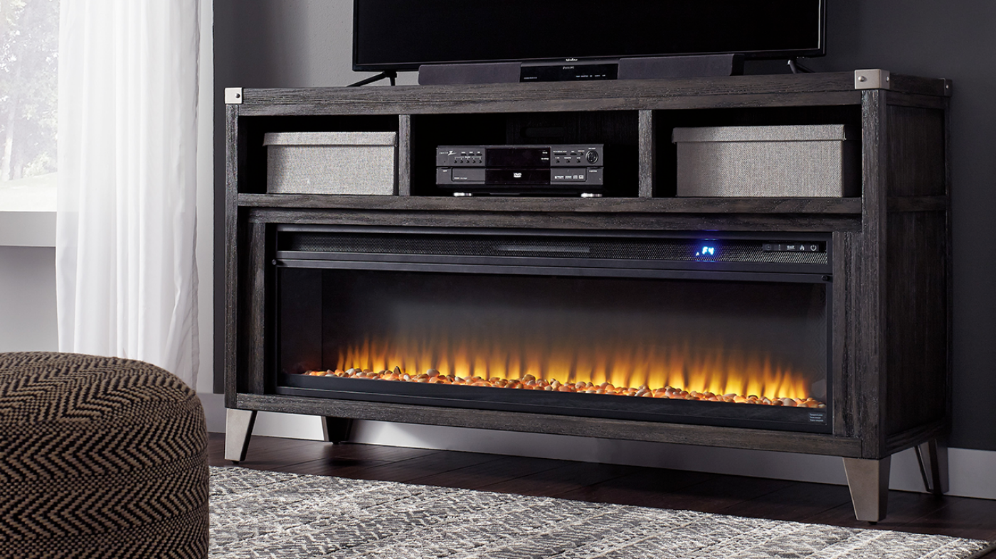 Room View of the Todoe TV Stand Console Table with Fireplace Insert in Gray by Ashley Furniture | Home Furniture Plus Bedding