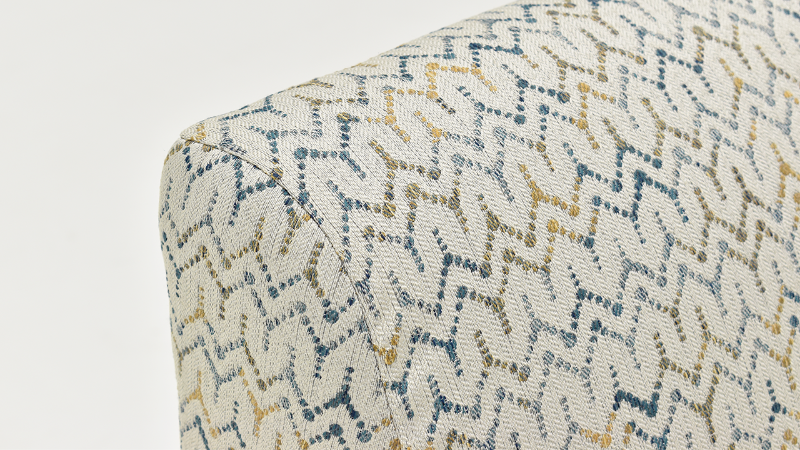 Angled Close Up View of the Arm of the Feather Accent Chair in a Multicolored Pattern by Behold Home | Home Furniture Plus Bedding