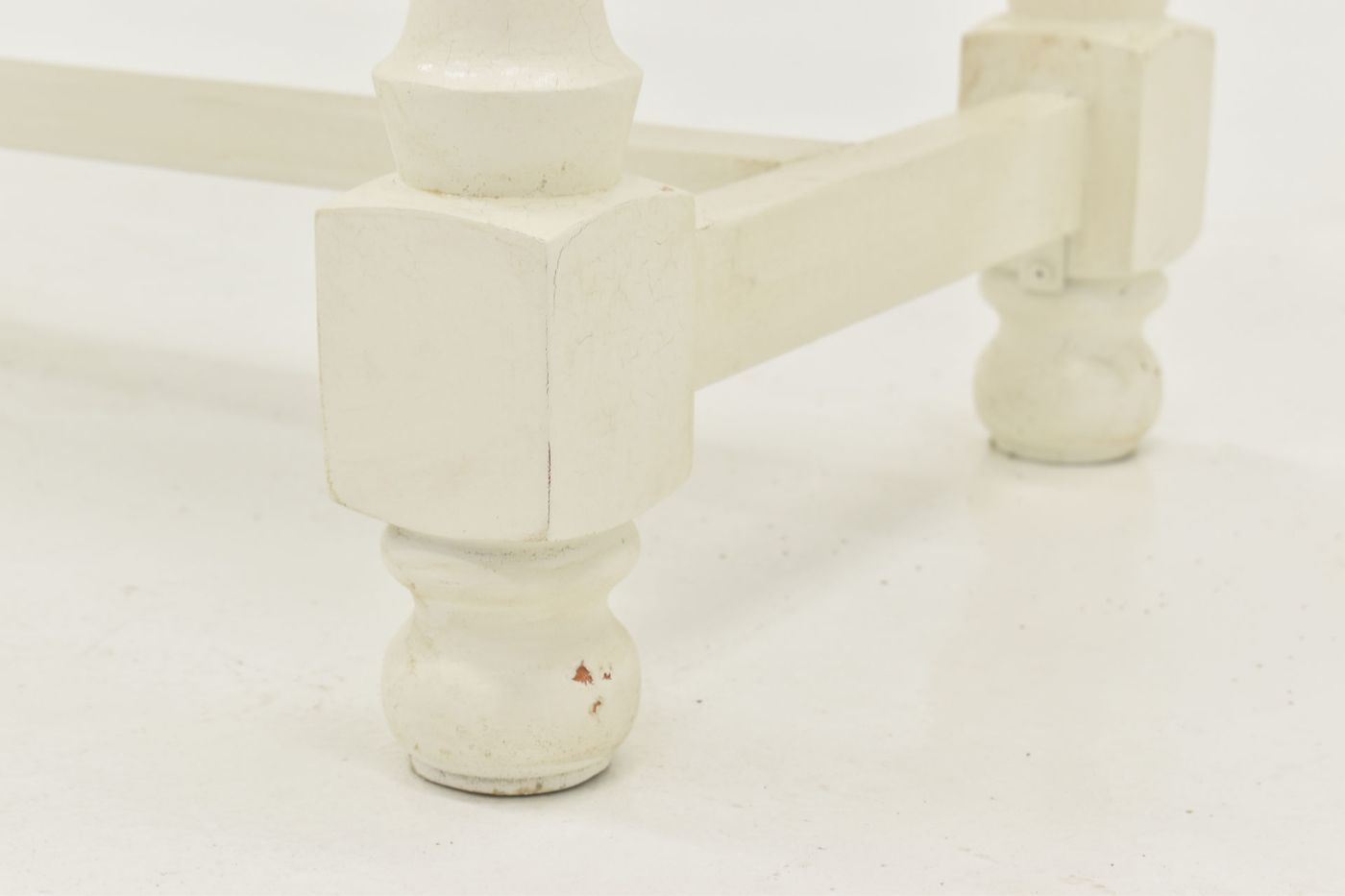 Close Up View of the Foot on the Bellevue Sofa Table in Off-White by Vintage Furniture | Home Furniture Plus Bedding