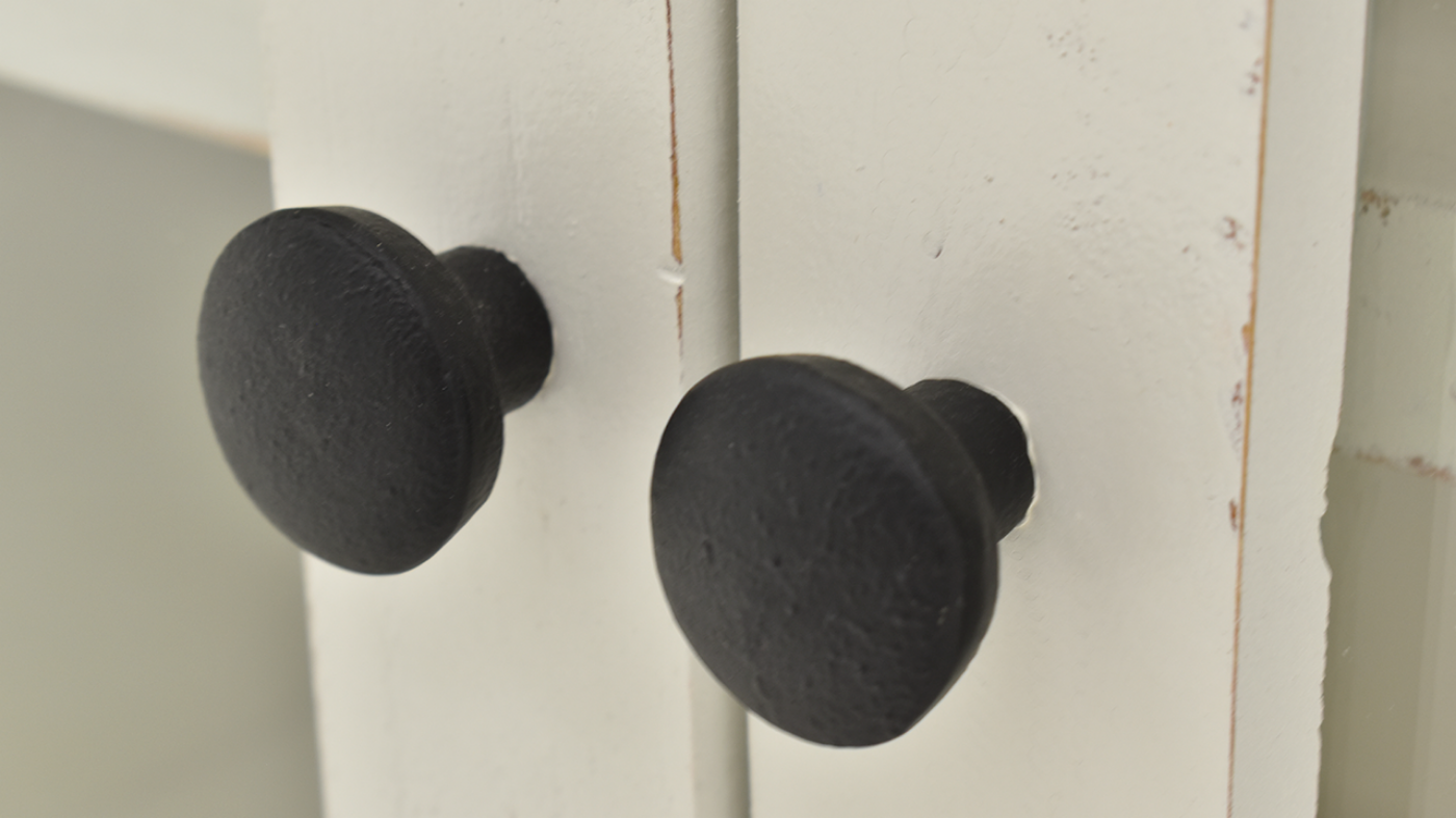 Close Up of the Dark Drawer Knobs on the Charleston TV Stand Console Cabinet - White | Home Furniture Plus Bedding	