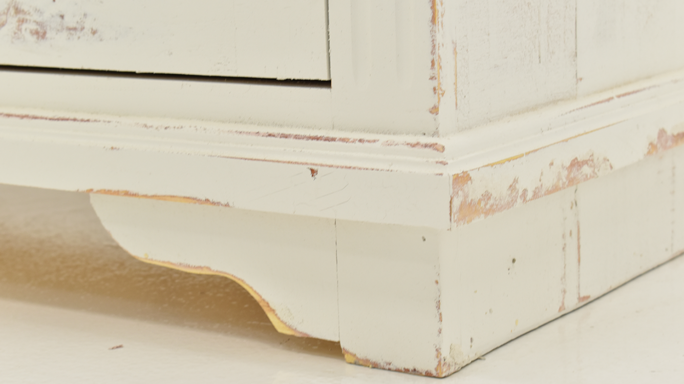 Close Up of the bottom corner on the Charleston TV Stand Console Cabinet - White | Home Furniture Plus Bedding	